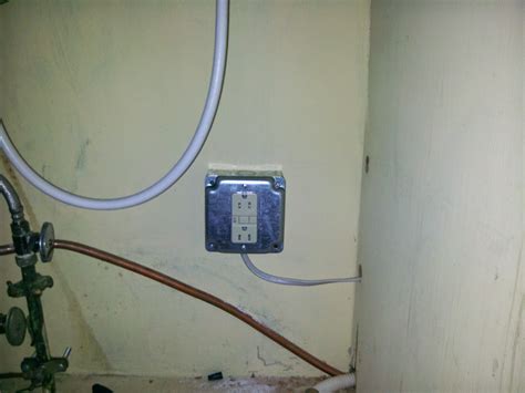 distance of electrical junction box from laundry sink|electrical outlet under sink cabinet.